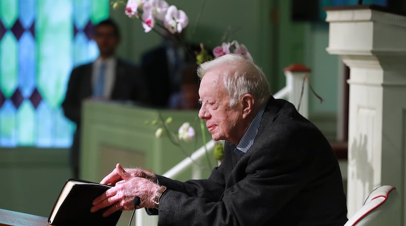 June 9, 2019 Plains: President Jimmy Carter, 94, the 39th U.S. president and Plains native, opens his Bible to begin the lesson as he returns to Maranatha Baptist Church to teach Sunday School less than a month after falling and breaking his hip on Sunday, June 9, 2019, in Plains. Curtis Compton/ccompton@ajc.com