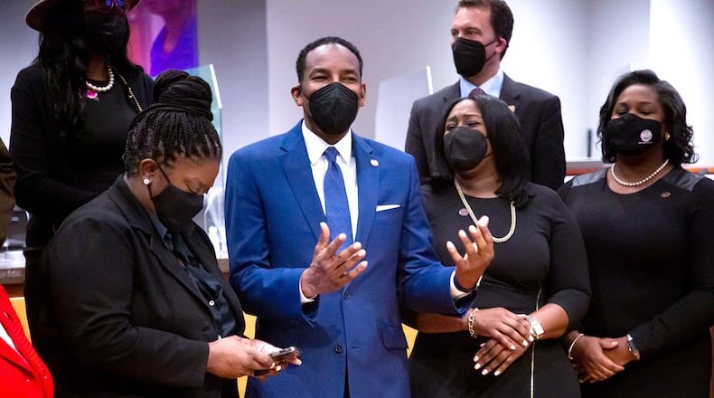 Atlanta Mayor Andre Dickens stands next to Eshé Collins, right, and Superintendent Lisa Herring after the swearing-in ceremony for the new Atlanta Board of Education members Monday, Jan. 10, 2021. STEVE SCHAEFER FOR THE ATLANTA JOURNAL-CONSTITUTION