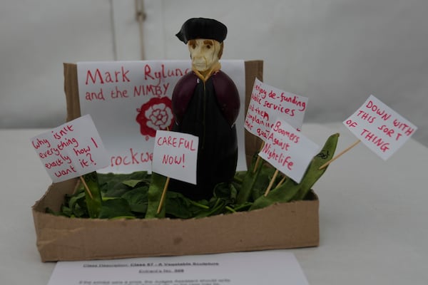 A vegetable sculpture entitled 'Mark Rylunch and the NIMBY campaign' on display at the vegetable sculpture competition at Lambeth County show in London, Saturday, June 7, 2025. (AP Photo/Joanna Chan)