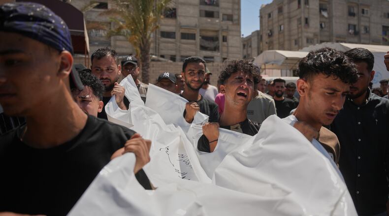 Mourners carry the body of Palestinian Abdullah Moussa, 30, who was killed in an Israeli airstrike, during his funeral in Khan Younis, southern Gaza Strip, Saturday, June 27, 2026. (AP Photo/Abdel Kareem Hana)