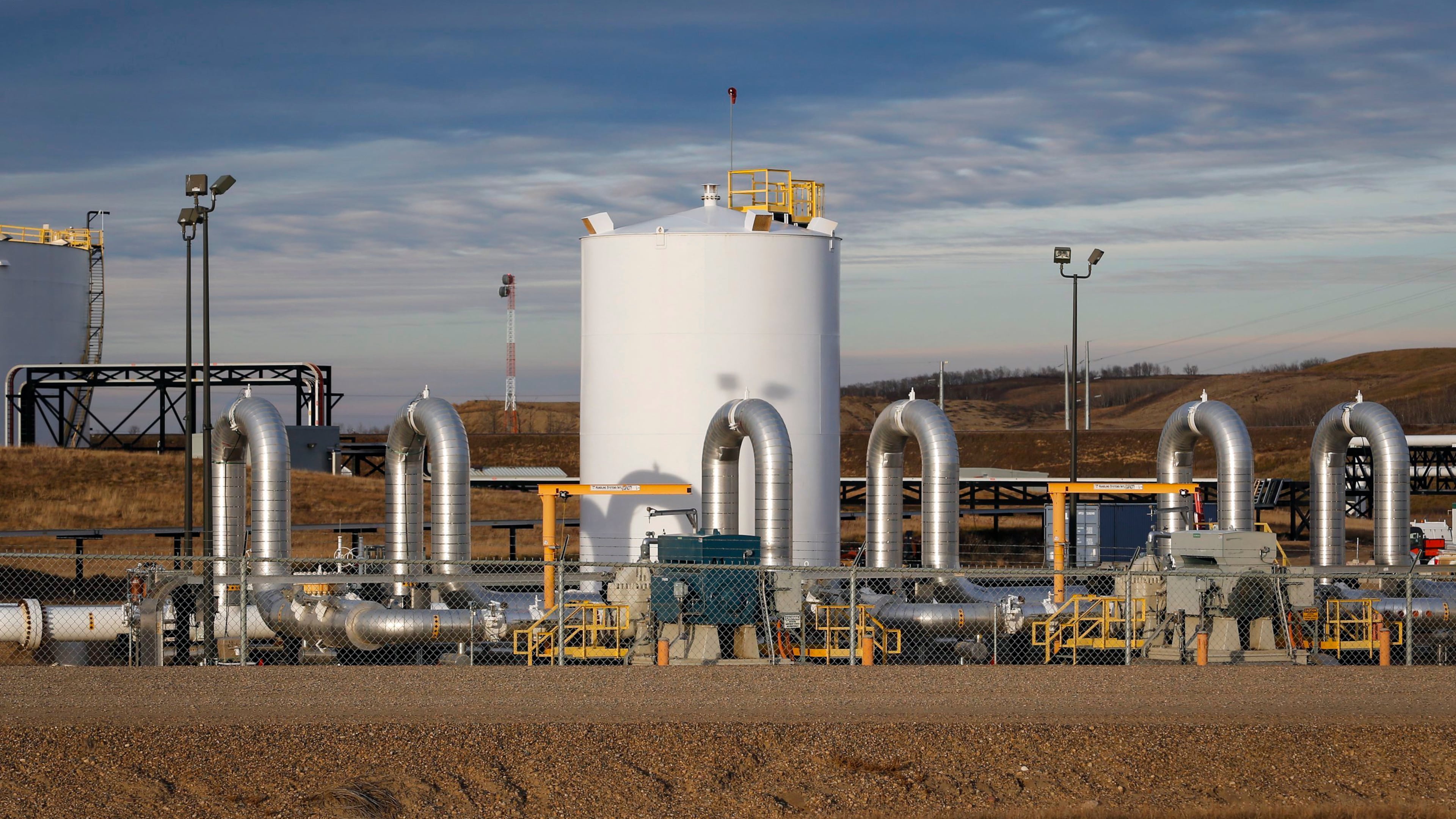 FILE - A Keystone pipeline facility stands in Hardisty, Alberta, Nov. 6, 2015. (Jeff McIntosh/The Canadian Press via AP, File)