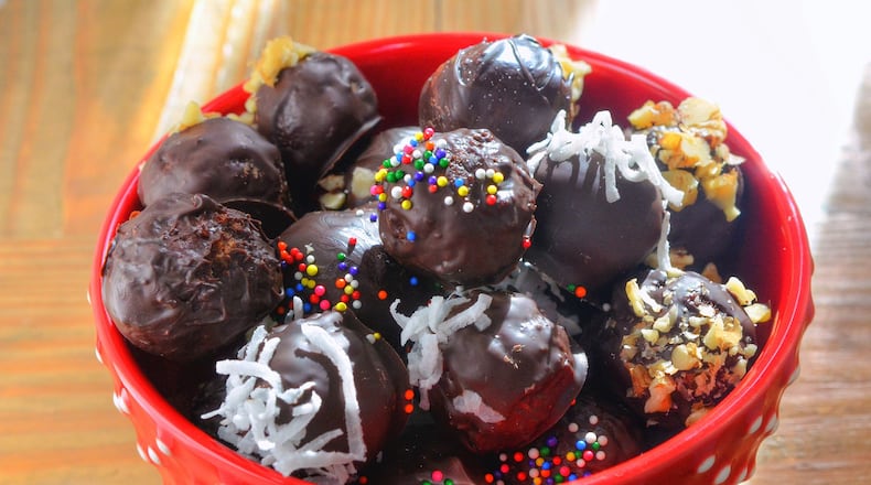 Panettone Truffles are made with crumbs of traditional Italian sweet bread, milk, cream cheese and sugar, then shaped and covered in chocolate. STYLING BY CATERINA SCARANO / CONTRIBUTED BY CHRIS HUNT PHOTOGRAPHY