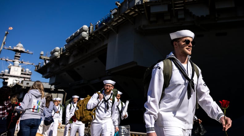 Sailors make their way to their loved ones after disembarking from the USS Gerald R. Ford at Naval Station Norfolk in Norfolk, Va. on Saturday, May 16, 2026, following an 11 month deployment. (Kendall Warner/The Virginian-Pilot via AP)