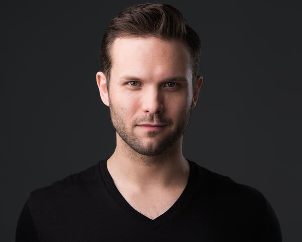 Joseph Lattanzi portrays Figaro in the Atlanta Opera's production of "The Barber of Seville."
