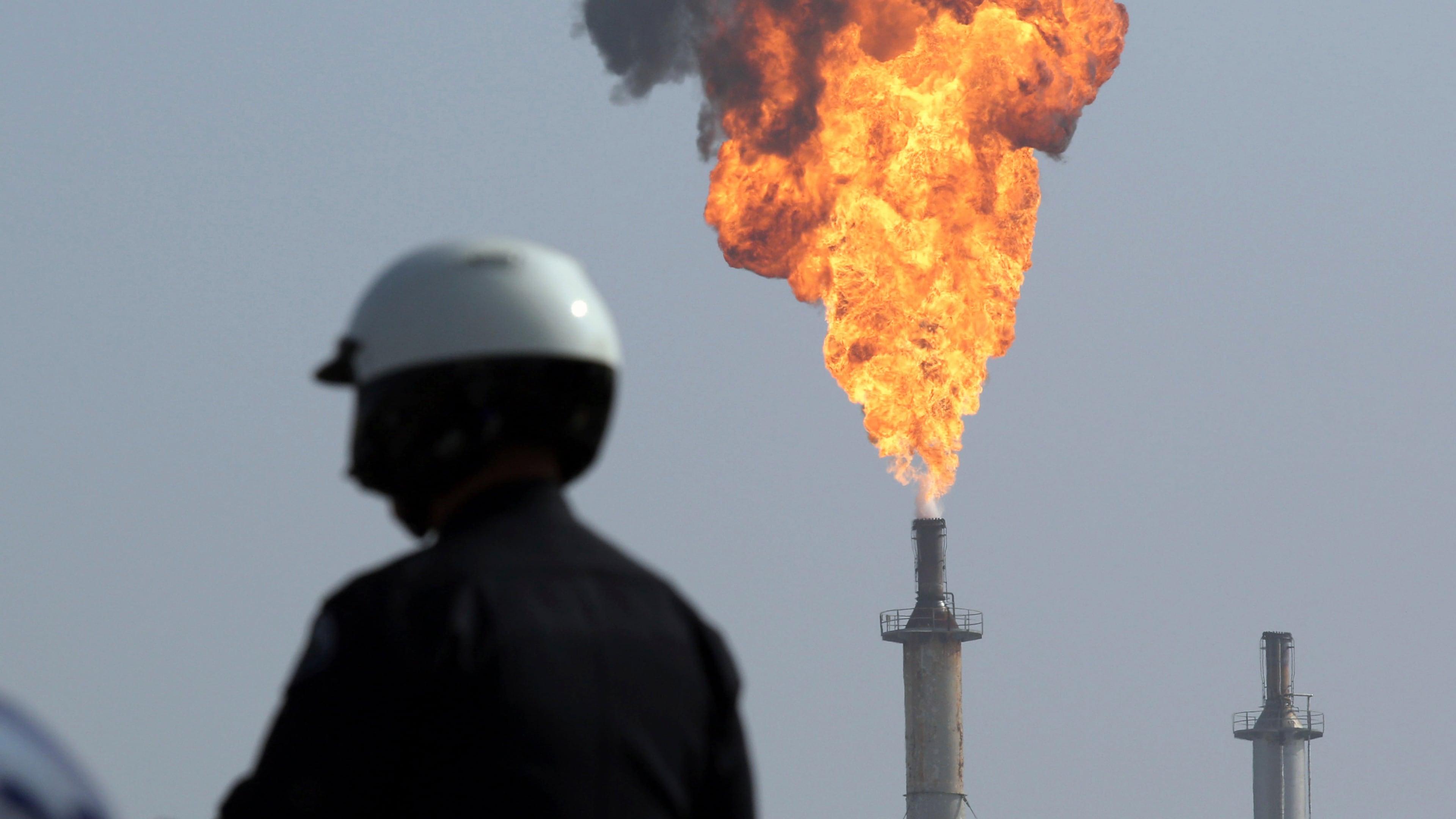 FILE - A very large smokestack flare burns off flammable product after an explosion in a processing facility at the ExxonMobil refinery in Torrance, Calif., on Feb. 18, 2015. (Chuck Bennett//The Orange County Register via AP, File)