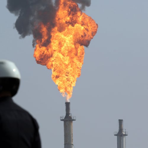 FILE - A very large smokestack flare burns off flammable product after an explosion in a processing facility at the ExxonMobil refinery in Torrance, Calif., on Feb. 18, 2015. (Chuck Bennett//The Orange County Register via AP, File)