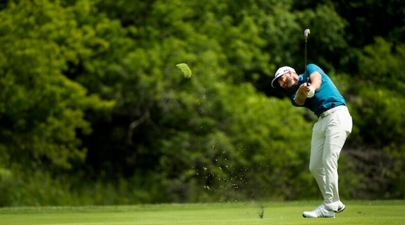 Dustin Johnson, of the United States, hits his approach shot on the 14th hole during the Canadian Open golf tournament at Glen Abbey golf club, in Oakville, Ontario, on Saturday, July 29, 2017. (Nathan Denette/The Canadian Press via AP)