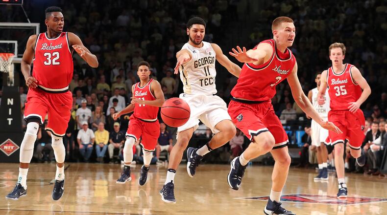 Georgia Tech guard Josh Heath passes off on a fast break against four Belmont defenders in their NIT second-round game on Sunday, March 19, 2017, in Atlanta. Curtis Compton/ccompton@ajc.com