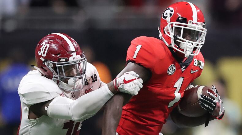 Georgia tailback Sony Michel evades Alabama linebacker Mack Wilson during the second half of the College Football Playoff National Championship on January 8, 2018, in Atlanta. Curtis Compton/ccompton@ajc.com