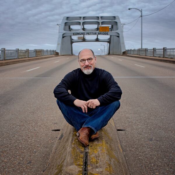 Photographer Jerry Siegel poses on the iconic Edmund Pettus Bridge in his hometown of Selma, Alabama. A National Portrait Gallery curator says the museum seeks to "expand its representation of southern portrait subjects as well as southern photographers.” (Courtesy of Jerry Siegel)