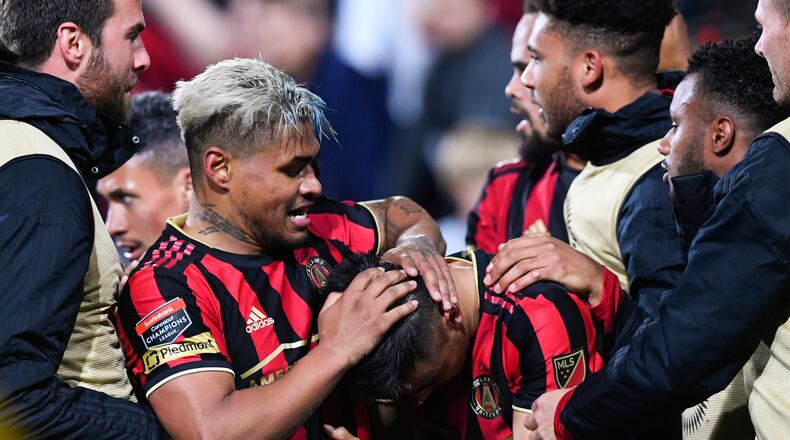 Atlanta Unitedâs Josef Martinez grabs the head of Gonzalo Martinez while celebrating his goal with him during the second half of a soccer match in the Scotiabank Concacaf Champions League, Tuesday, Feb. 25, 2020, in Kennesaw, Ga. (John Amis, Atlanta Journal Constitution)