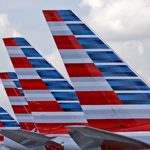 FILE - American Airlines passenger planes are parked at Miami International Airport, in Miami on July 17, 2015. (AP Photo/Alan Diaz, File)