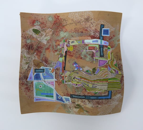 Eric Mack's mixed media work "GRV-0708" on wood veneer with red sand, raintree leaves, tissue paper, acrylic paint. (Courtesy of Whitespace)