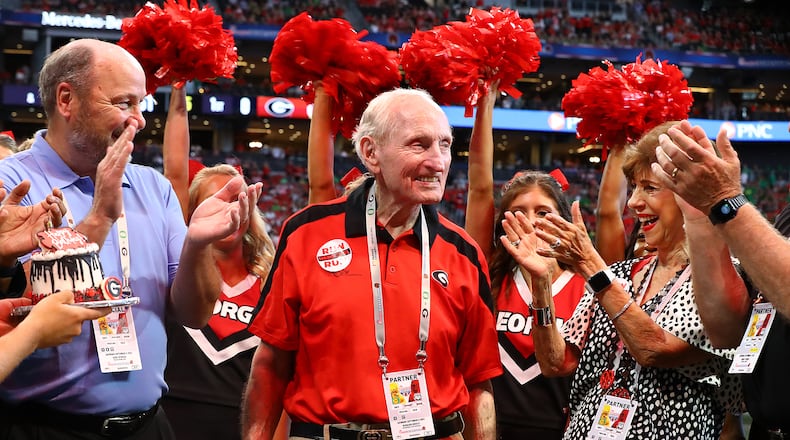Former Georgia head coach Vince Dooley and his wife Barbara celebrate his 90th birthday with an on-field celebration before Georgia played Oregon on Saturday, Sept. 3, 2022, in Atlanta.   “Curtis Compton / Curtis Compton@ajc.com