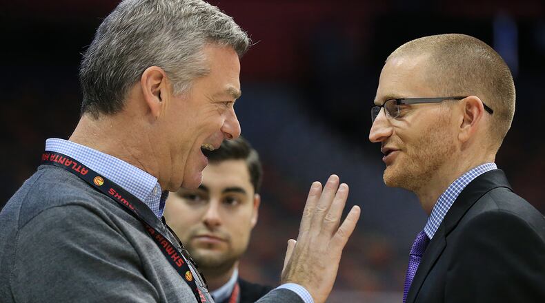 102715 ATLANTA: -- Hawks owner Tony Ressler (left) talks with general manager Wes Wilcox as the team prepares to play their first regular season basketball game "home opener" against the Pistons on Tuesday, Oct. 27, 2015, in Atlanta. Curtis Compton / ccompton@ajc.com