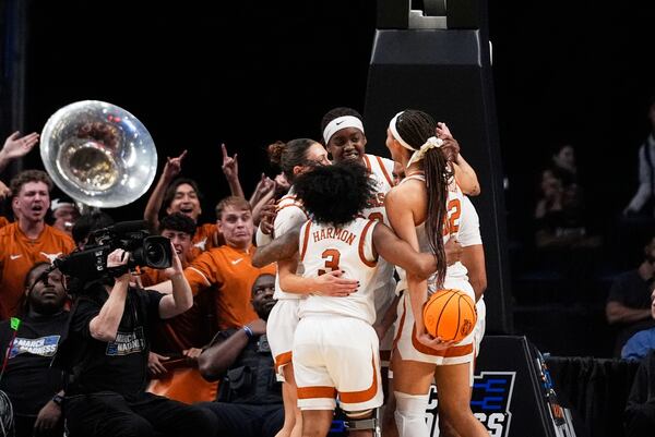 Texas celebrates during the second half against TCU in the Elite Eight of the NCAA college basketball tournament, Monday, March 31, 2025. in Birmingham, Ala. (AP Photo/Gerald Herbert)