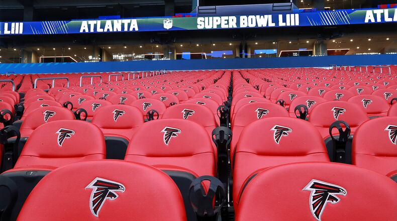 Some of the seats inside Mercedes-Benz Stadium still bear the Falcons logo while it is prepared for the Super Bowl on Tuesday, Jan. 22, 2019, in Atlanta.   Curtis Compton/ccompton@ajc.com