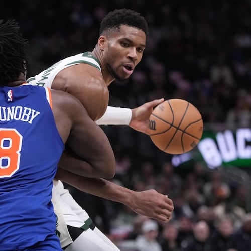 Milwaukee Bucks' Giannis Antetokounmpo tries to get past New York Knicks' OG Anunoby during the second half of an NBA basketball game Tuesday, Oct. 28, 2025, in Milwaukee. (AP Photo/Morry Gash)
