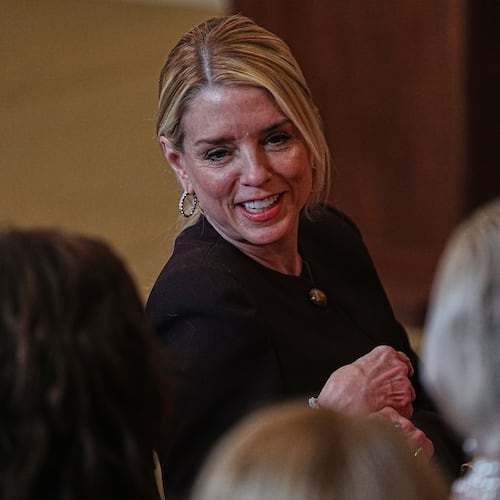 Attorney General Pam Bondi arrives before President Donald Trump attends a women's history month event in the East Room at the White House, Thursday, March 12, 2026, in Washington. (AP Photo/Allison Robbert)