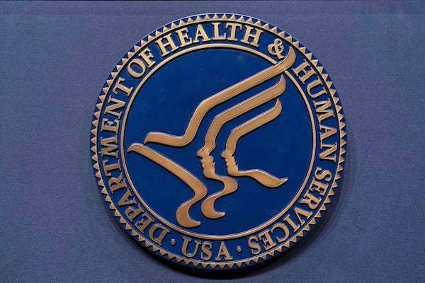 FILE - The Health and Human Services seal is seen before a news conference with Secretary Robert F. Kennedy Jr. in Washington, April 16, 2025. (AP Photo/Jose Luis Magana, File)