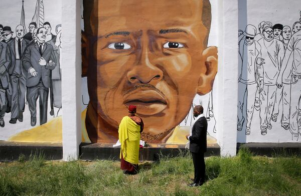 FILE - A mural depicts Freddie Gray, who died from spinal injuries sustained during transport in a Baltimore police van, in Baltimore, May 7, 2015. (AP Photo/Patrick Semansky, File)