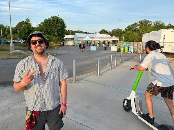 Shane Regal of Acworth said "I'm loving it" after walking up the hill to the entrance of the SweetWater 420 Festival on Saturday, April 18, 2026, at Shirley Clarke Franklin Park in Atlanta. (Rodney Ho/AJC)