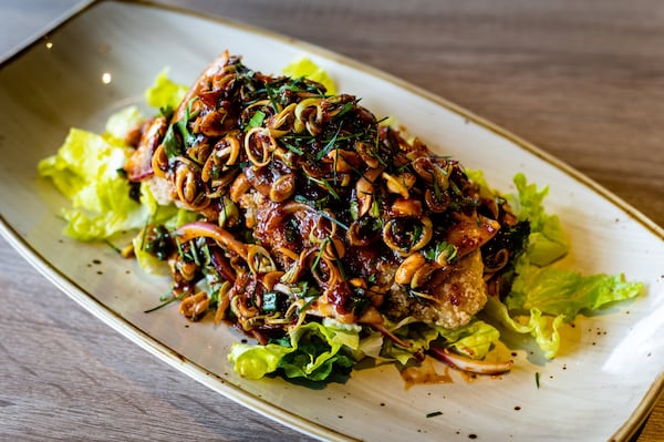 Thaicoon & Sushi Bar’s Pla Lui Suan is lightly battered fried catfish with spicy toppings. CONTRIBUTED BY HENRI HOLLIS