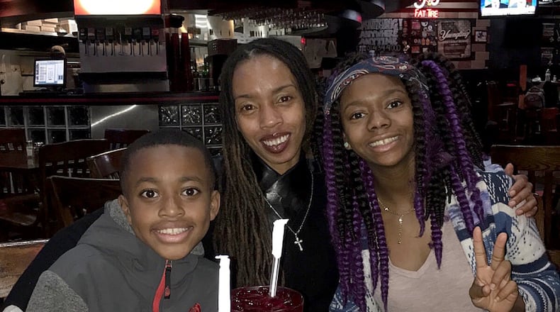 Claudine Hargrove, 38, was stabbed to death Aug. 11 inside a Gwinnett County hotel room two days after her birthday. She is survived by her 11-year-old son Naiyim and her 15-year-old daughter Nya. (Family provided photo)