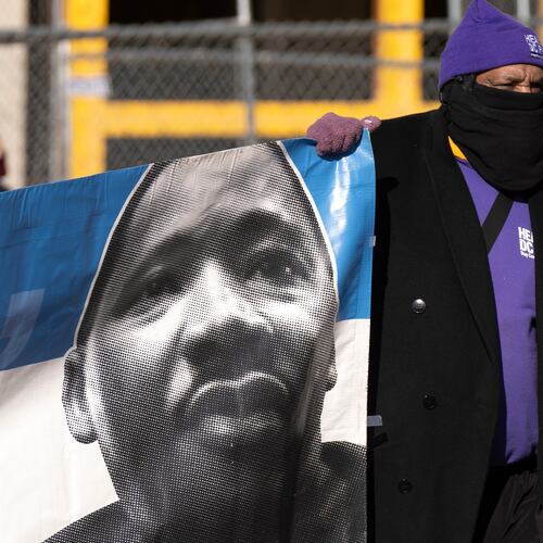 A participant carries a banner with an image of Martin Luther King, Jr., during the District of Columbia's annual Martin Luther King Day parade Monday, Jan. 19, 2026, in Washington. (AP Photo/Mark Schiefelbein)