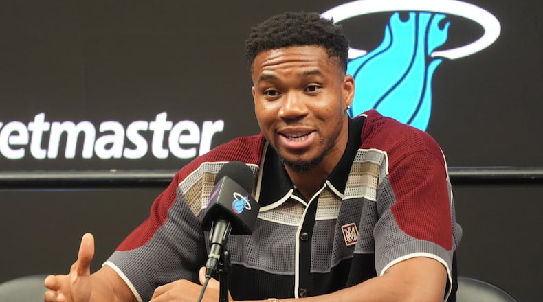 Giannis Antetokounmpo speaks during a news conference where he was introduced as a new member of the Miami Heat team Thursday, July 16, 2026, in Miami. (AP Photo/Marta Lavandier)