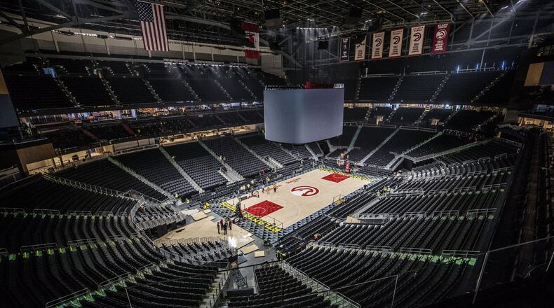 The basketball floor and scoreboard are in place inside the refurbished State Farm Arena. BOB ANDRES / BANDRES@AJC.COM
