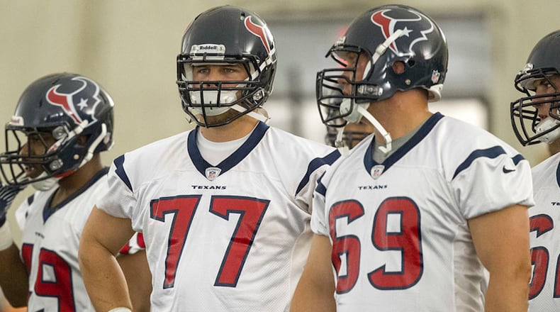 HOUSTON - MAY 10: Tackles David Quessenberry #77 and Nick Mondek #69 of the Houston Texans Houston Texans rookie mini camp on May 10, 2013 in Houston, Texas. (Photo by Bob Levey/Getty Images)