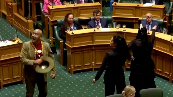 In this image from video provided by New Zealand Parliament TV, lawmakers, from foreground left, Rawiri Waititi, Hana-Rāwhiti Maipi-Clarke and Debbie Ngarewa-Packer perform a Māori haka to protest a proposed law during a session of Parliament in Wellington, New Zealand, on Nov. 14, 2024, (New Zealand Parliament TV via AP)