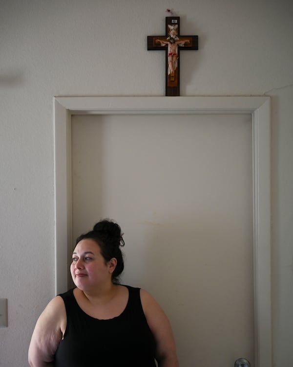 Annalinda Martinez, photographed at her home in Kennesaw Thursday, August 21, 2025, says the state of Georgia won't stop billing her almost $500 a month after taking away her six eldest children and putting them into foster care in 2018. (Daniel Varnado for the AJC)