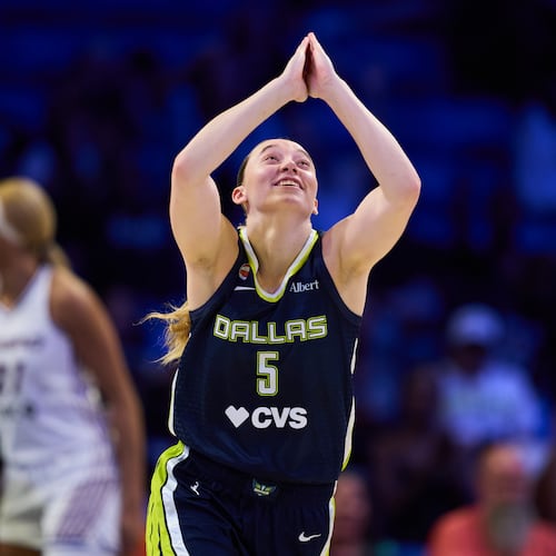 Dallas Wings' Paige Bueckers celebrates after sinking a basket in the second half of a WNBA basketball game against the Toronto Tempo in Arlington, Texas, Wednesday, Aug. 12, 2026. (AP Photo/Tony Gutierrez)