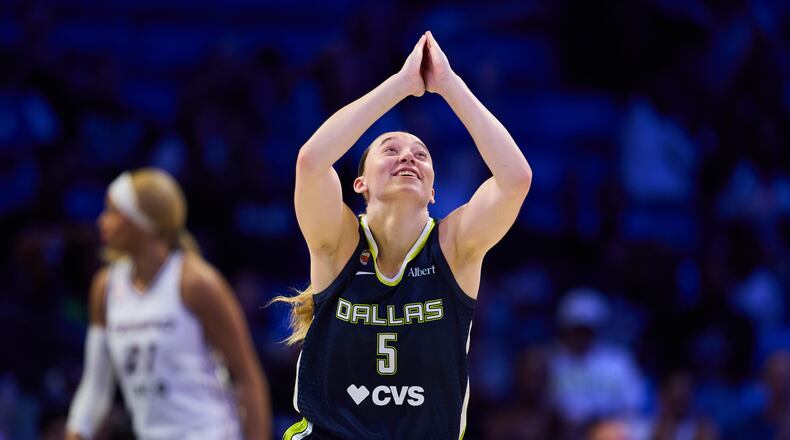 Dallas Wings' Paige Bueckers celebrates after sinking a basket in the second half of a WNBA basketball game against the Toronto Tempo in Arlington, Texas, Wednesday, Aug. 12, 2026. (AP Photo/Tony Gutierrez)