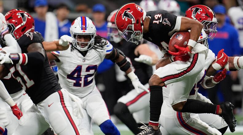 Atlanta Falcons wide receiver Jamal Agnew (14) leaps for yardage during the first half of an NFL football game against the Buffalo Bills, Monday, Oct. 13, 2025, in Atlanta. (Mike Stewart/AP)