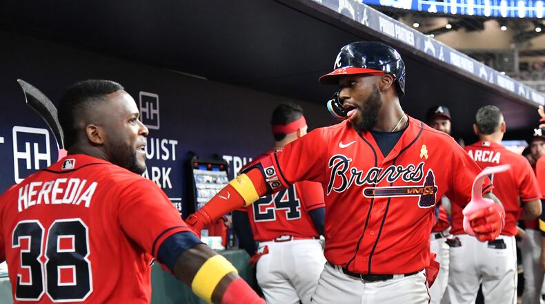 Braves outfielder Michael Harris (right) has stepped up to help Jackson, Miss.: He is donating $23,000 to help those affected by the water crisis. (Hyosub Shin / Hyosub.Shin@ajc.com)