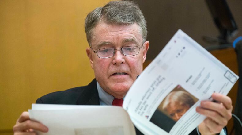 03/09/2018 -- Atlanta, GA - Charles "Bill" Crane reads a published article concerning the incident between Claud "Tex" McIver and his wife, Diane McIver, during the sixteenth day of the Tex McIver trial before Fulton County Chief Judge Robert McBurney on Monday, March 9, 2018. Bill Crane assisted Tex McIver in releasing a statement to the media shortly after the incident that left Diane McIver dead. ALYSSA POINTER/ALYSSA.POINTER@AJC.COM