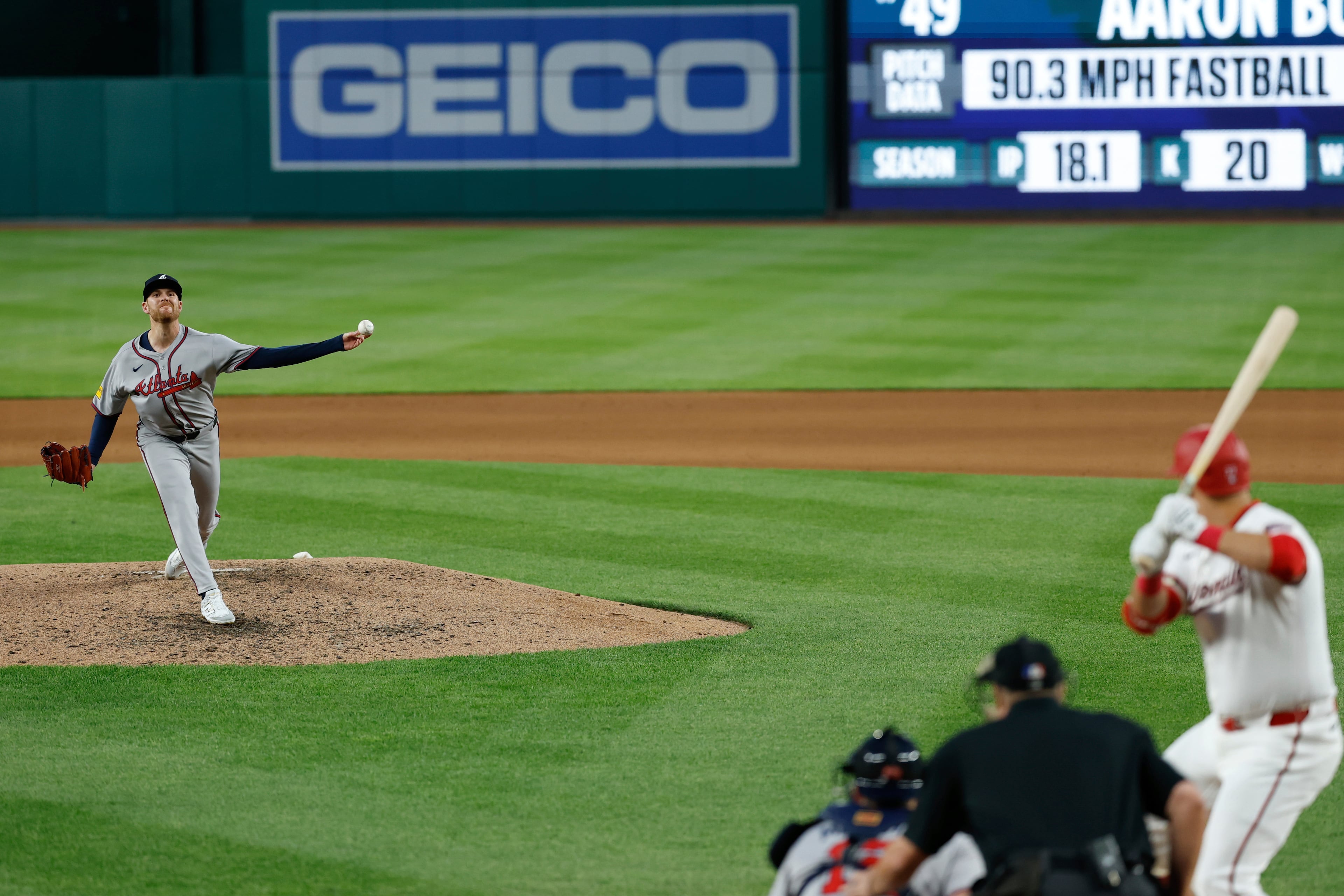 Atlanta Braves pitcher Aaron Bummer throws as Washington Nationals' Nathaniel Lowe bats during the fifth inning a baseball game in Washington, Tuesday, May 20, 2025. (AP Photo/Terrance Williams)