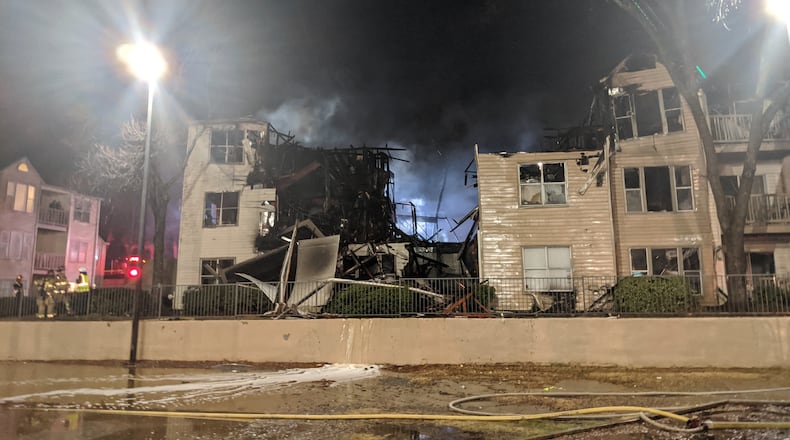 More than two dozen people were displaced after the apartment building caught fire and partially collapsed.