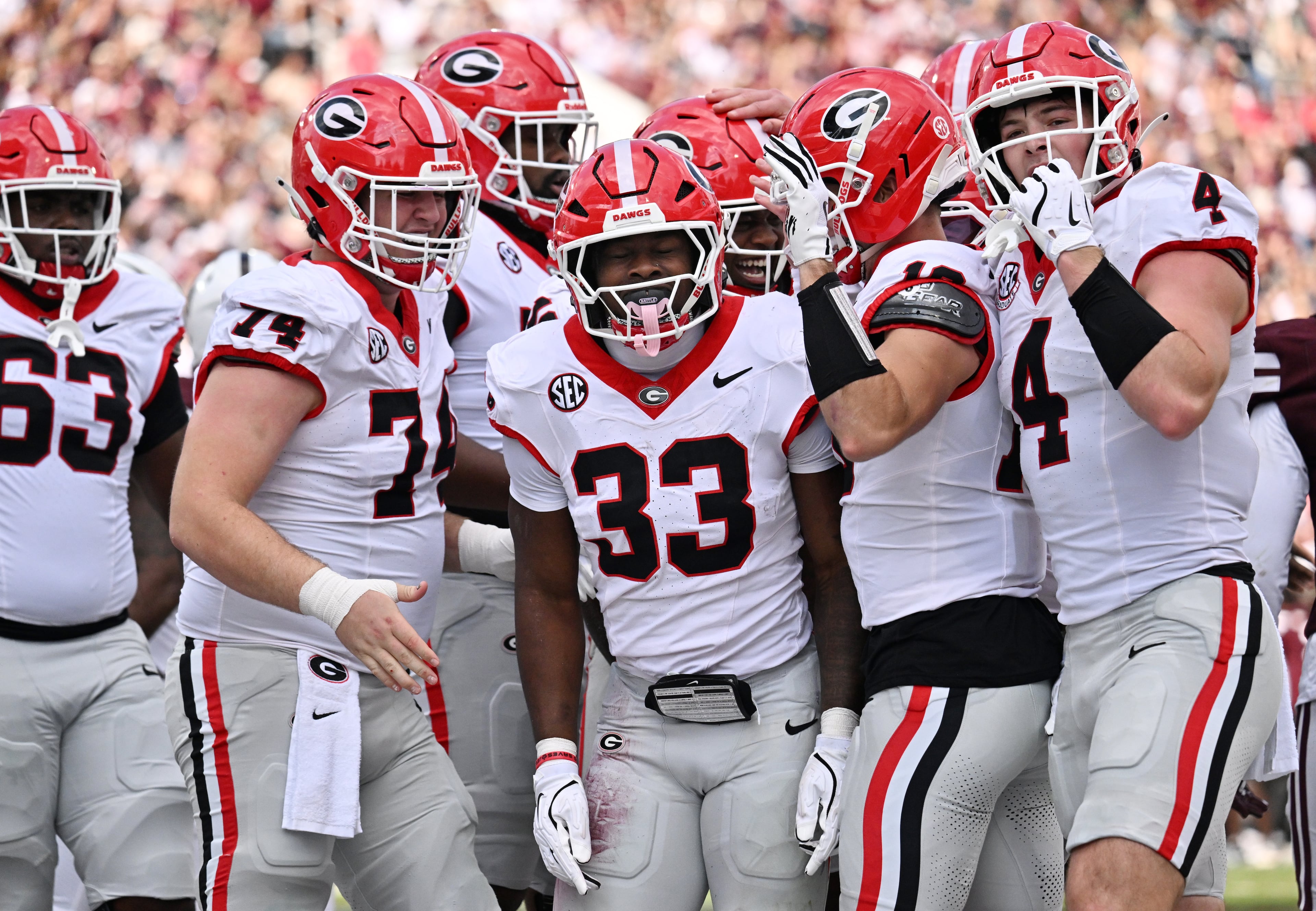 Georgia running back Chauncey Bowens (33) celebrates with teammates after scoring a touchdown during the first half in an NCAA football game at Davis Wade Stadium, Saturday, November 8, 2025, in Starkville, Mississippi. (Hyosub Shin / AJC)