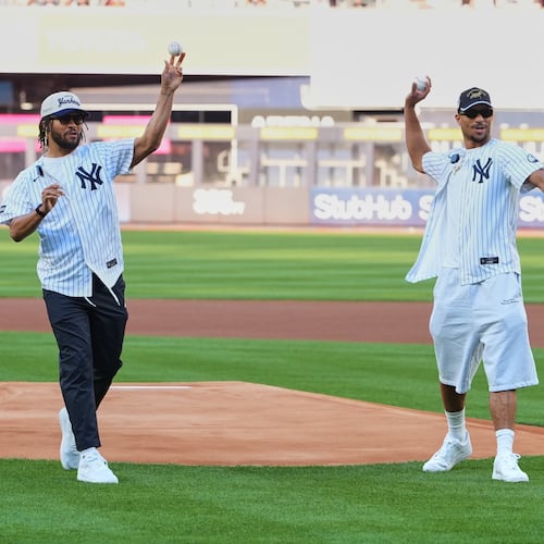 New York Knicks' Josh Hart, right, and Jalen Brunson throw out a ceremonial first pitch before a baseball game between the Chicago White Sox and the New York Yankees Wednesday, June 17, 2026, in New York. (AP Photo/Frank Franklin II)