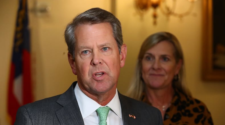081022 Atlanta: Governor Brian P. Kemp, with First Lady Marty Kemp, takes questions from the media following a special economic development announcement on Wednesday, August 10, 2022, in Atlanta.   “Curtis Compton / Curtis Compton@ajc.com