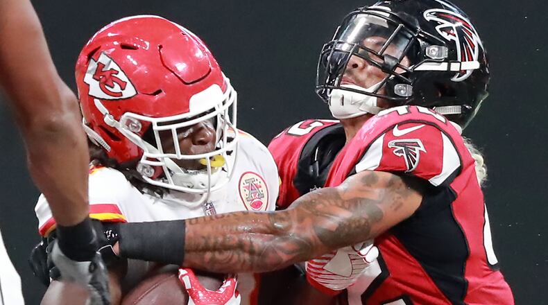 Falcons linebacker Duke Riley tackles Chiefs running back Kareem Hunt during the first half of their exhibition game Friday, Aug. 17, 2018, at Mercedes-Benz Stadium in Atlanta.