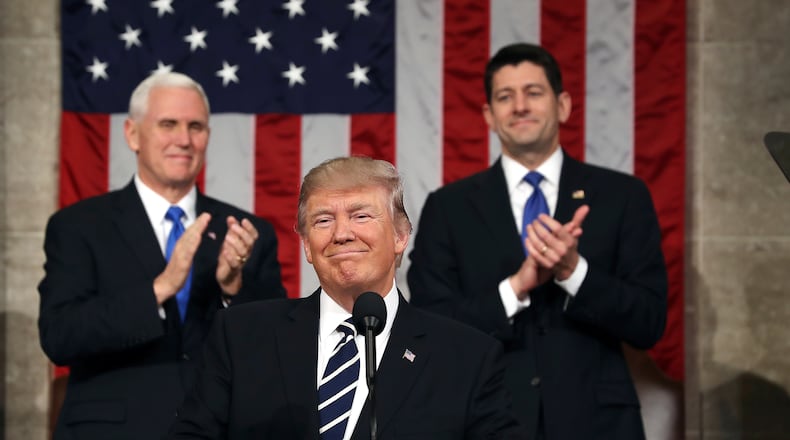 President Donald Trump, flanked by Vice President Mike Pence and U.S. House Speaker Paul Ryan, has enjoyed strong support from his fellow Republicans who hold seats in Congress. That’s especially true for the Republican members of the U.S. House and U.S. Senate from Georgia, who, so far, have voted with the president 98.8 percent of the time. (Jim Lo Scalzo/Pool Image via AP)