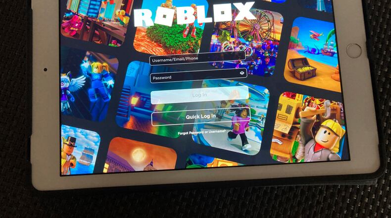 FILE - The gaming platform Roblox is displayed on a tablet, Oct. 30, 2021, in New York. (AP Photo/Leon Keith, File)