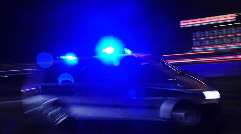 A police car with lights flashing is pictured on October 2, 2010 in Bremen. AFP PHOTO / JOHANNES EISELE (Photo credit should read JOHANNES EISELE/AFP/Getty Images)