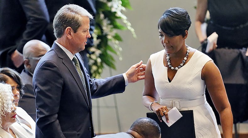August 28, 2019 - Atlanta - Gov. Brian Kemp stands as Mayor Keisha Lance Bottoms returns to her seat after delivering her reflections.  A "Celebration of Life" was held for Christopher Redding Edwards II, Erin Victoria Edwards, and their mother, Dr. Marsha Edwards at Cascade United Methodist Chruch in Atlanta. Marsha Edwards was accused of the fatal shooting last week.