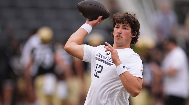 FILE - Georgia Tech quarterback Aaron Philo warms up before an NCAA college football game against Colorado, Friday, Aug. 29, 2025, in Boulder, Colo. (AP Photo/David Zalubowski, File)